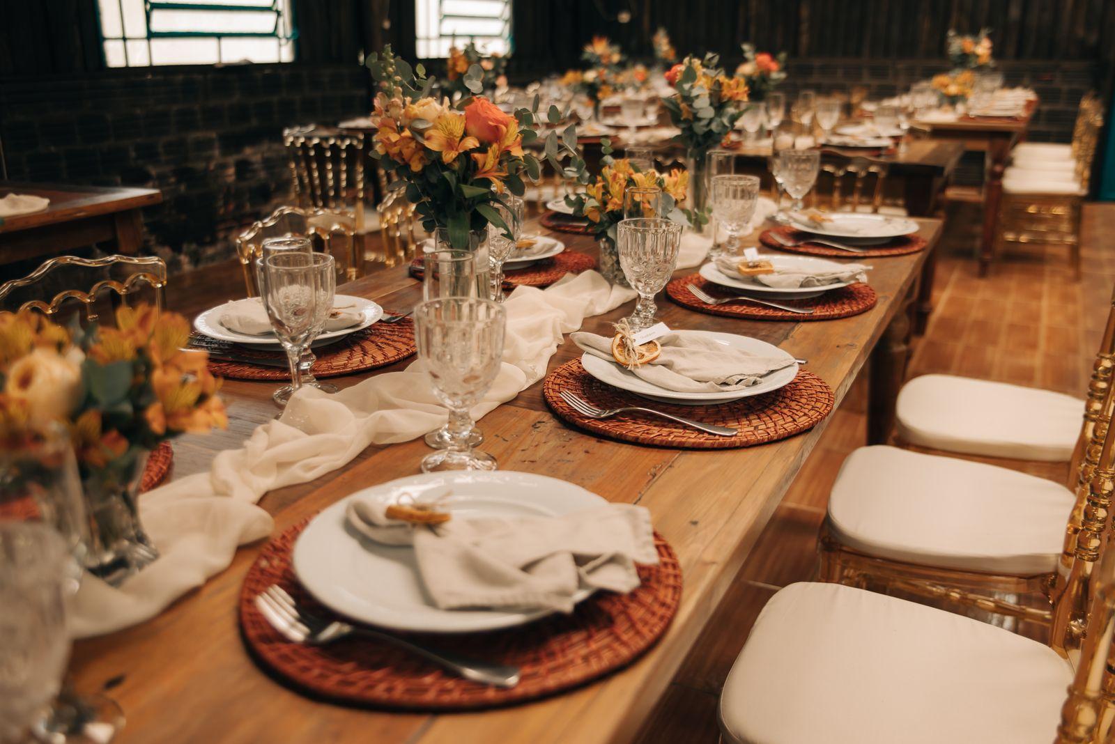 Wedding reception tables set with flowers and glassware